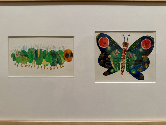 photo of two small Eric Carle illustrations, caterpillar and butterfly, matted and framed together on display